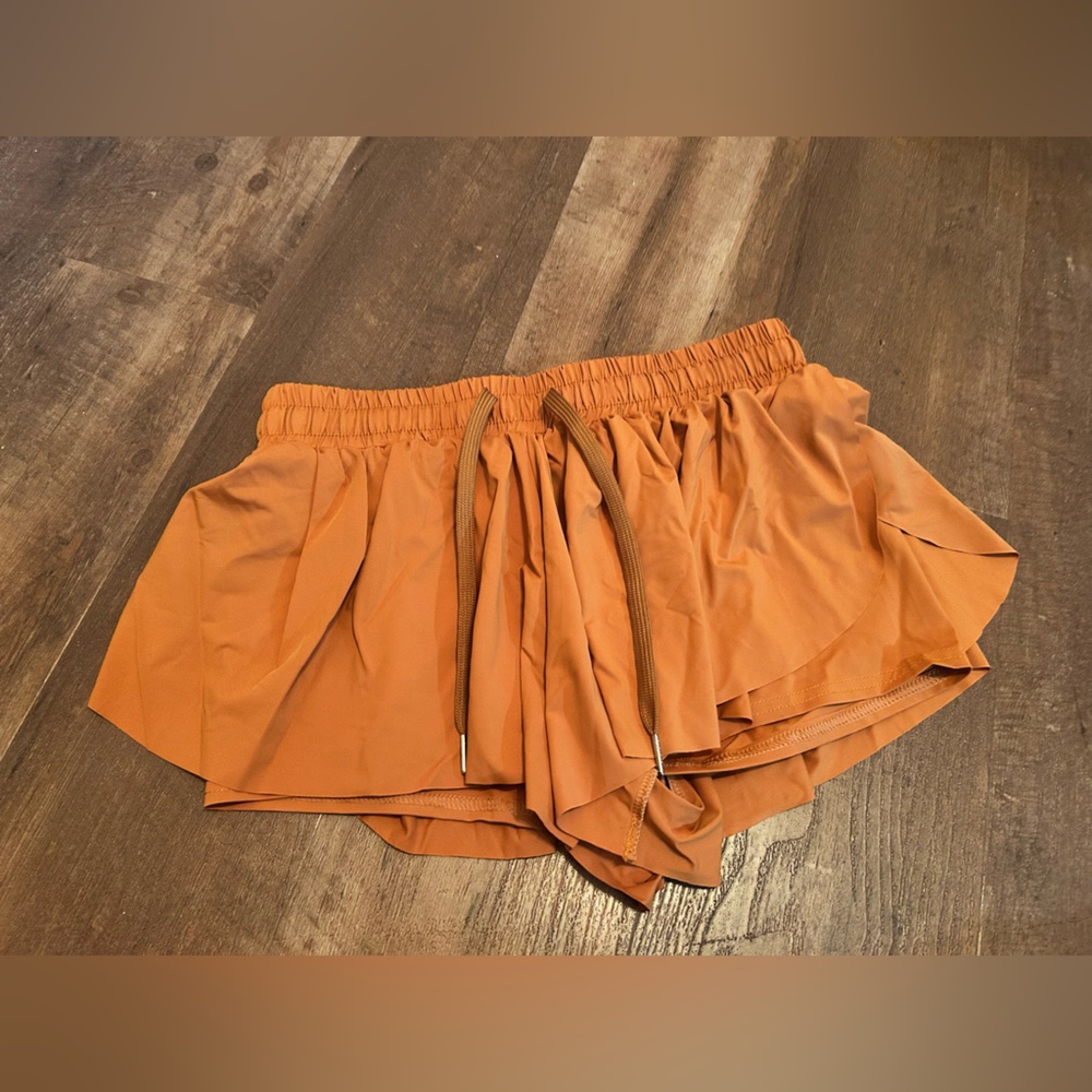 Women’s size medium, dark orange, elastic waist workout shorts